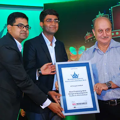 Most Promising Web Design and Development Studio in Ahmedabad - Award received from Anupam Kher
